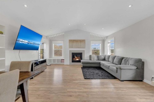 105 Ash Close, Blackfalds, AB - Indoor Photo Showing Living Room With Fireplace