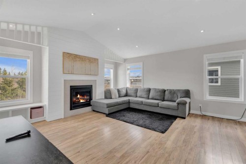 105 Ash Close, Blackfalds, AB - Indoor Photo Showing Living Room With Fireplace