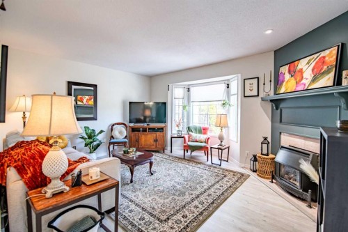 9 Rutherford Place, Red Deer, AB - Indoor Photo Showing Living Room With Fireplace