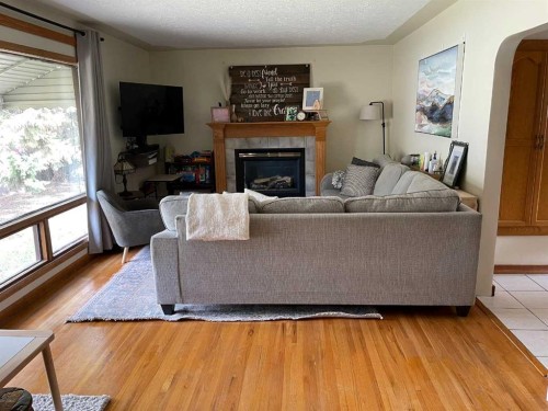 3405 52 Avenue, Red Deer, AB - Indoor Photo Showing Living Room With Fireplace