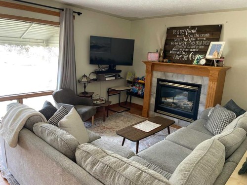 3405 52 Avenue, Red Deer, AB - Indoor Photo Showing Living Room With Fireplace