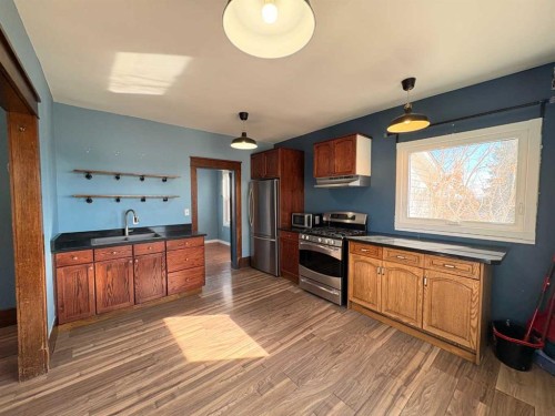 2021 23 Avenue, Delburne, AB - Indoor Photo Showing Kitchen With Stainless Steel Kitchen With Double Sink