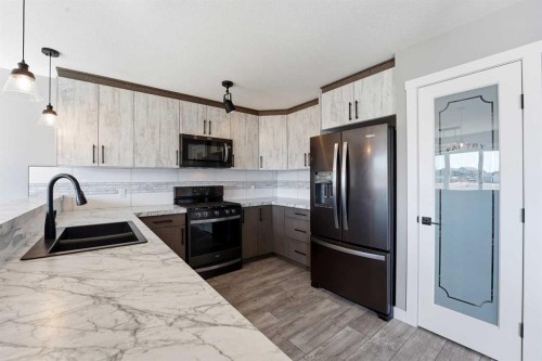 11 Aura Drive, Blackfalds, AB - Indoor Photo Showing Kitchen With Stainless Steel Kitchen With Double Sink