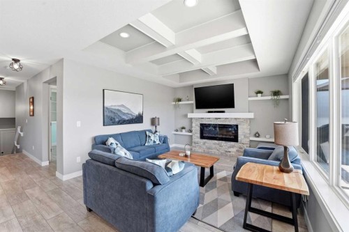 11 Aura Drive, Blackfalds, AB - Indoor Photo Showing Living Room With Fireplace