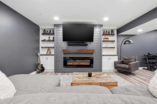 4625 48 Street, Sylvan Lake, AB - Indoor Photo Showing Living Room With Fireplace