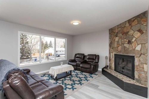 103 Westview Drive, Sylvan Lake, AB - Indoor Photo Showing Living Room With Fireplace