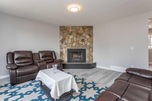 103 Westview Drive, Sylvan Lake, AB - Indoor Photo Showing Living Room With Fireplace