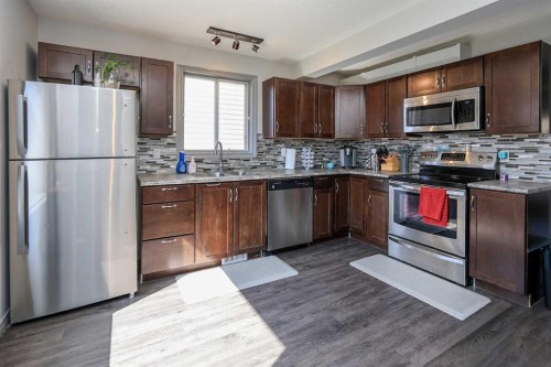 76 Good Crescent, Red Deer, AB - Indoor Photo Showing Kitchen With Stainless Steel Kitchen With Double Sink