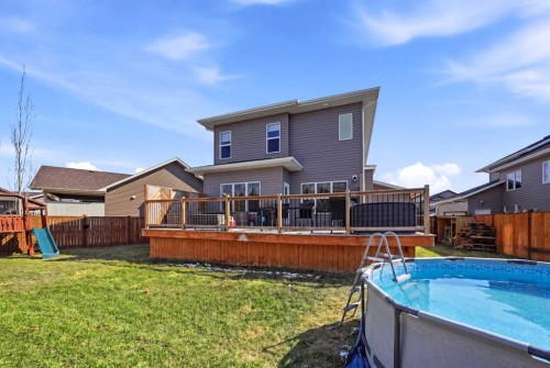 113 Coachman Way, Blackfalds, AB - Outdoor With Above Ground Pool With Deck Patio Veranda