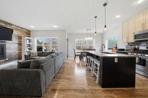 113 Coachman Way, Blackfalds, AB - Indoor Photo Showing Kitchen With Fireplace With Stainless Steel Kitchen With Upgraded Kitchen