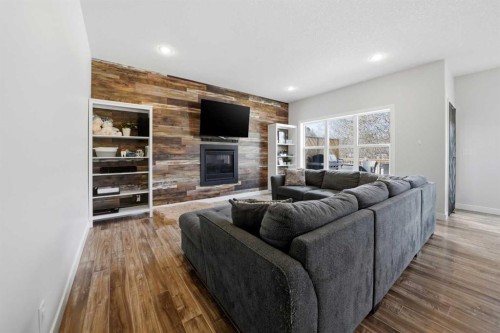 113 Coachman Way, Blackfalds, AB - Indoor Photo Showing Living Room With Fireplace