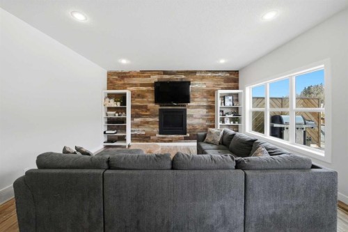 113 Coachman Way, Blackfalds, AB - Indoor Photo Showing Living Room With Fireplace