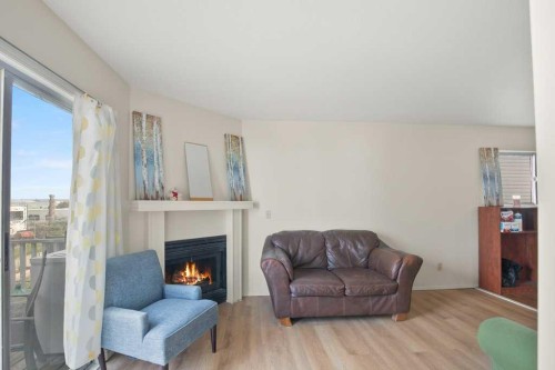 45 Hangingstone Drive, Lacombe, AB - Indoor Photo Showing Living Room With Fireplace