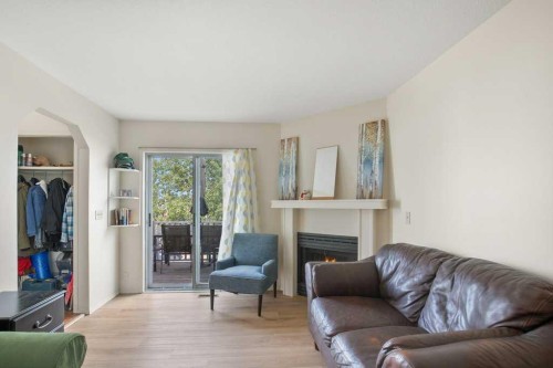 45 Hangingstone Drive, Lacombe, AB - Indoor Photo Showing Living Room With Fireplace