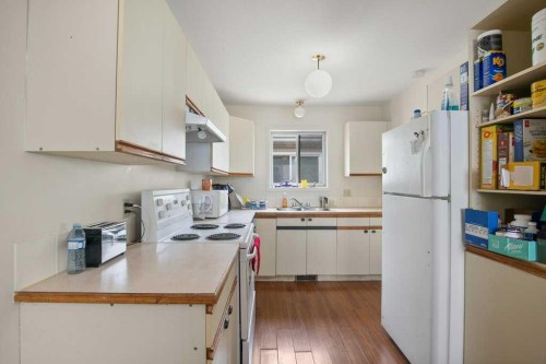 45 Hangingstone Drive, Lacombe, AB - Indoor Photo Showing Kitchen With Double Sink
