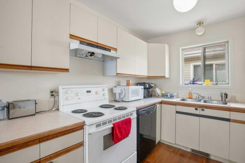 45 Hangingstone Drive, Lacombe, AB - Indoor Photo Showing Kitchen With Double Sink