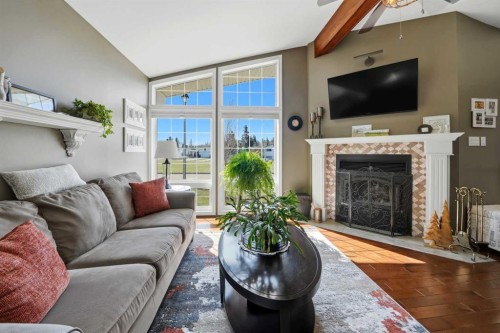6 Sydney Close, Red Deer, AB - Indoor Photo Showing Living Room With Fireplace