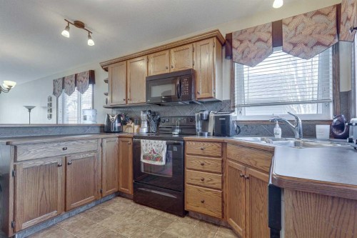 43 Inkster Close, Red Deer, AB - Indoor Photo Showing Kitchen With Double Sink