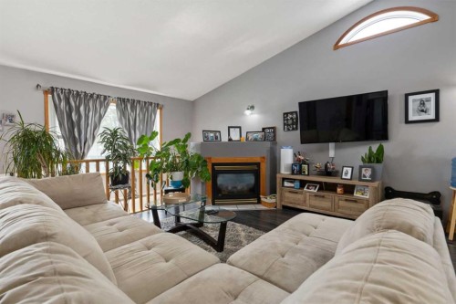 6122 32 Avenue, Camrose, AB - Indoor Photo Showing Living Room With Fireplace