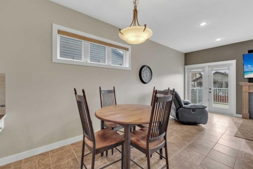 18 Shaw Close, Red Deer, AB - Indoor Photo Showing Dining Room With Fireplace