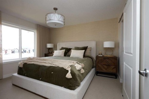 80 Emberside Grove, Cochrane, AB - Indoor Photo Showing Bedroom