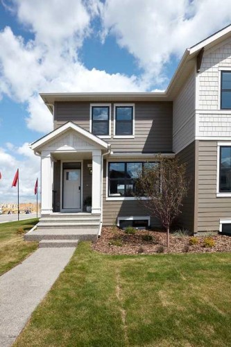 80 Emberside Grove, Cochrane, AB - Outdoor With Deck Patio Veranda With Facade