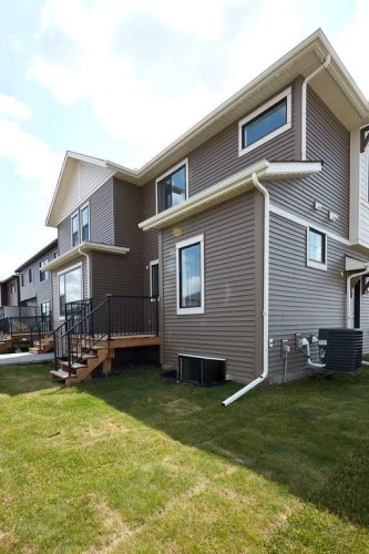 80 Emberside Grove, Cochrane, AB - Outdoor With Deck Patio Veranda