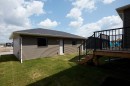 80 Emberside Grove, Cochrane, AB  - Outdoor With Deck Patio Veranda 