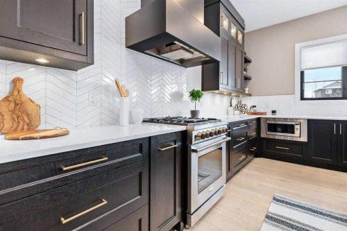 57 Larratt Close, Red Deer, AB - Indoor Photo Showing Kitchen With Upgraded Kitchen