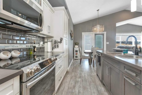 11 Craig Road, Sylvan Lake, AB - Indoor Photo Showing Kitchen With Double Sink With Upgraded Kitchen