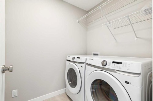 413 Shawnee Terrace Sw, Calgary, AB - Indoor Photo Showing Laundry Room