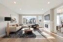 413 Shawnee Terrace Sw, Calgary, AB  - Indoor Photo Showing Living Room With Fireplace 