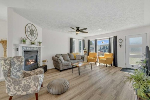 4702 57 Ave, Rimbey, AB - Indoor Photo Showing Living Room With Fireplace