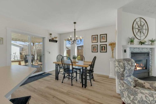 4702 57 Ave, Rimbey, AB - Indoor Photo Showing Dining Room With Fireplace
