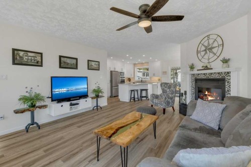 4702 57 Ave, Rimbey, AB - Indoor Photo Showing Living Room With Fireplace