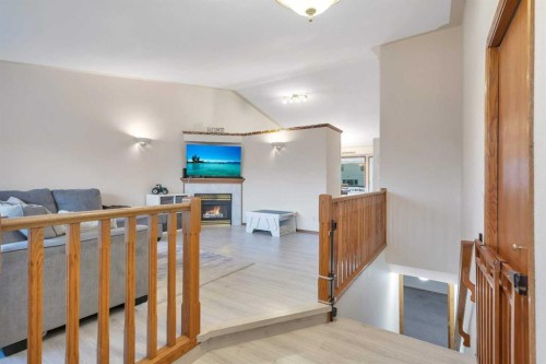 34 Lund Close, Red Deer, AB - Indoor Photo Showing Other Room With Fireplace
