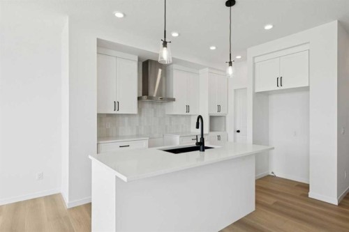 17 Southborough Common, Cochrane, AB - Indoor Photo Showing Kitchen With Upgraded Kitchen
