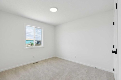 17 Southborough Common, Cochrane, AB - Indoor Photo Showing Other Room