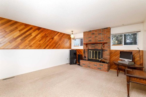 90 Welton Crescent, Red Deer, AB - Indoor Photo Showing Living Room With Fireplace