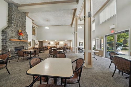 330-56 Carroll Crescent, Red Deer, AB - Indoor With Fireplace