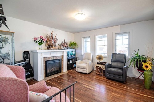 172 Ibbotson Close, Red Deer, AB - Indoor Photo Showing Living Room With Fireplace