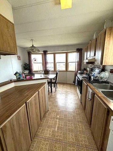 4908 46 Street, Hardisty, AB - Indoor Photo Showing Kitchen With Double Sink