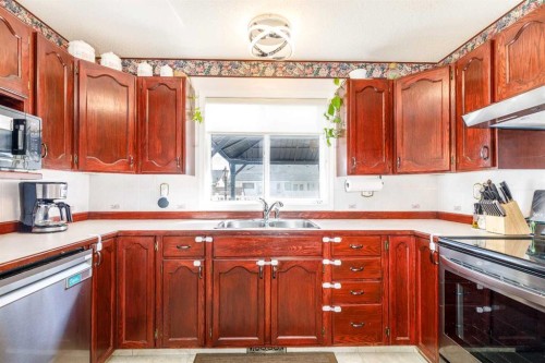 49 Kirkland Drive, Red Deer, AB - Indoor Photo Showing Kitchen With Double Sink