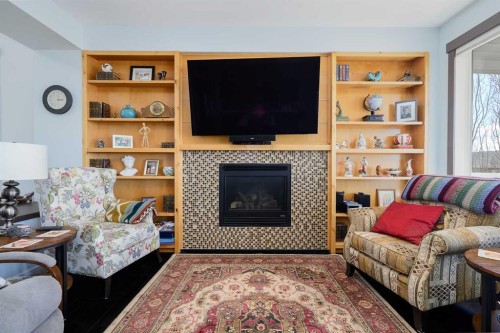 20 Ingle Close, Red Deer, AB - Indoor Photo Showing Living Room With Fireplace