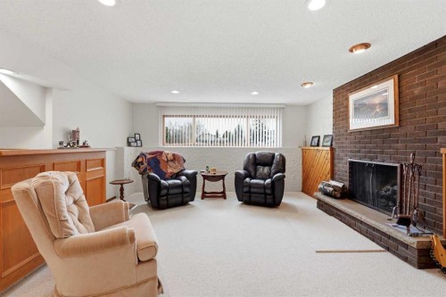 77 Allan Close, Red Deer, AB - Indoor Photo Showing Living Room With Fireplace