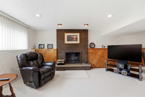77 Allan Close, Red Deer, AB - Indoor Photo Showing Living Room With Fireplace