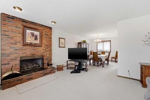 77 Allan Close, Red Deer, AB - Indoor Photo Showing Living Room With Fireplace