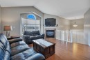 68 Iverson Close, Red Deer, AB  - Indoor Photo Showing Living Room With Fireplace 