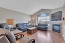 68 Iverson Close, Red Deer, AB  - Indoor Photo Showing Living Room With Fireplace 