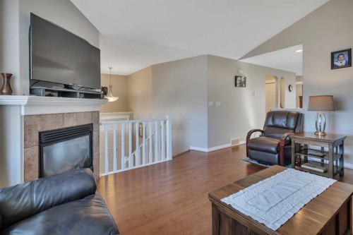 68 Iverson Close, Red Deer, AB - Indoor Photo Showing Living Room With Fireplace